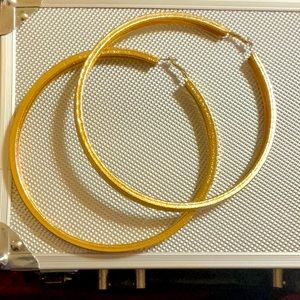 Large Gold plated hoop earrings. Very fashionable and trendy.